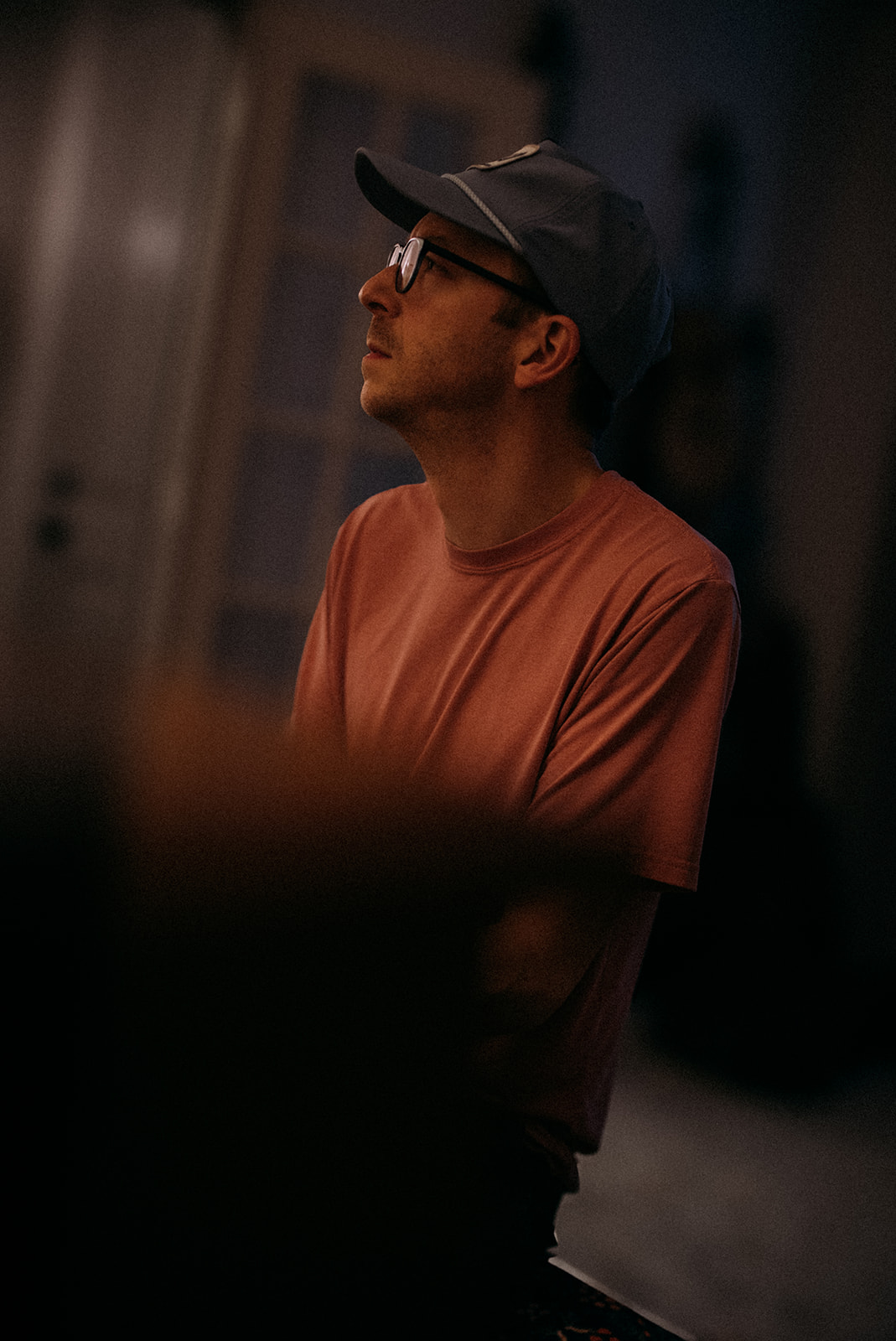 Brent Pendergraft looking into the distance while sitting at the piano